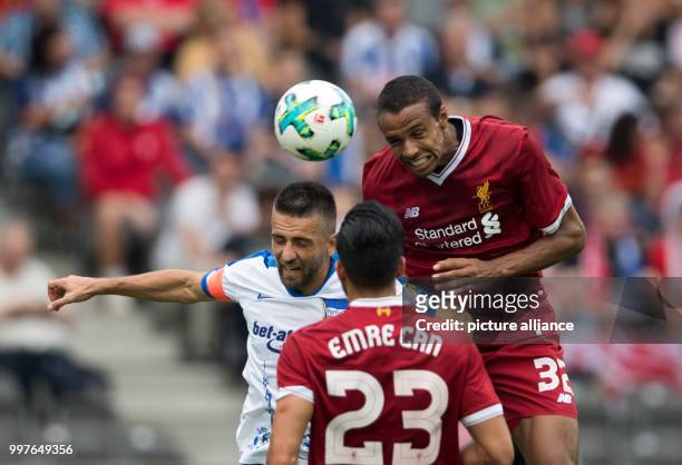 Hertha's Vedad Ibisevic and Liverpool's Joel Matip vie for the ball during the international club friendly soccer match between Hertha BSC and FC...