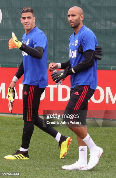 Joel Pereira and Lee Grant of Manchester United in action during a first team training session at Aon Training Complex on July 13, 2018 in...