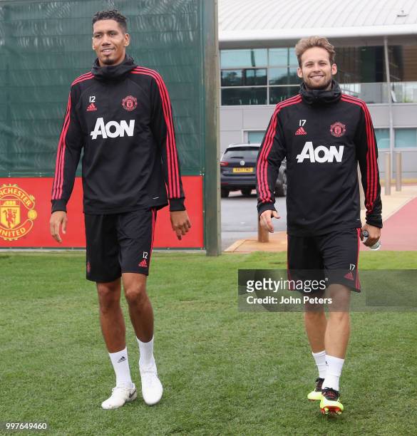 Chris Smalling and Daley Blind of Manchester United in action during a first team training session at Aon Training Complex on July 13, 2018 in...
