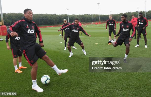 Anthony Martial, Antonio Valencia and Ro-Shaun Williams of Manchester United in action during a first team training session at Aon Training Complex...