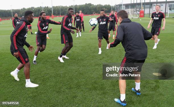 Timothy Fosu-Mensah, Ro-Shaun Williams, Axel Tuanzebe, Antonio Valencia and Ander Herrera of Manchester United in action during a first team training...