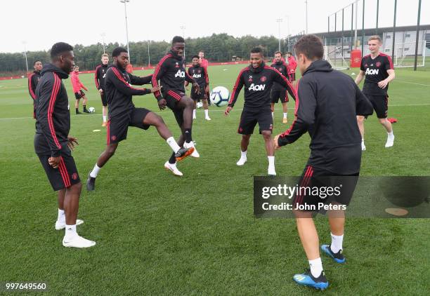 Timothy Fosu-Mensah, Ro-Shaun Williams, Axel Tuanzebe, Antonio Valencia and Ander Herrera of Manchester United in action during a first team training...