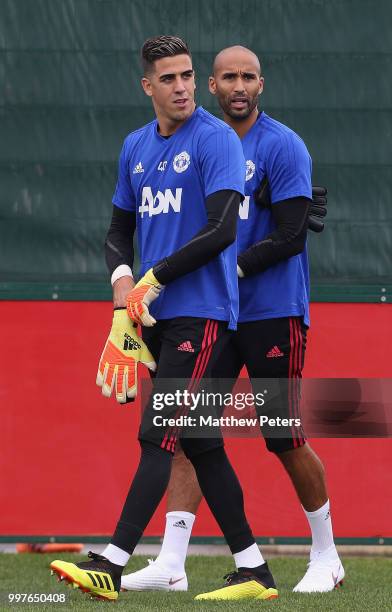 Joel Pereira and Lee Grant of Manchester United in action during a first team training session at Aon Training Complex on July 13, 2018 in...