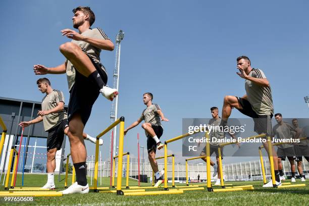 Daniele Rugani and Andrea Barzagli during a Juventus training session at Juventus Training Center on July 13, 2018 in Turin, Italy.