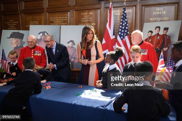 First Lady, Melania Trump, accompanied by Philip May, makes Remembrance Day poppies with schoolchildren and British Army veterans, known as Chelsea...
