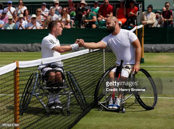 July 13: Alfie Hewett of Great Britain and Stefan Olsson of Sweden shake hands at the end of the mens wheelchair semi final at the All England Lawn...