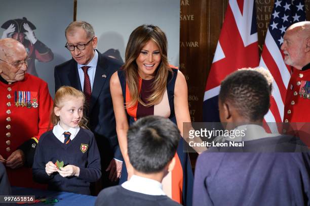 First Lady, Melania Trump, accompanied by Philip May, makes Remembrance Day poppies with schoolchildren and British Army veterans, known as Chelsea...