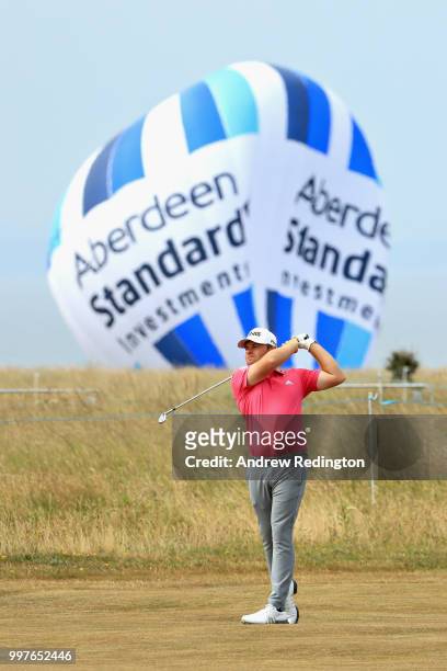 Tyrrell Hatton of England takes his second shot on hole sixteen during day two of the Aberdeen Standard Investments Scottish Open at Gullane Golf...