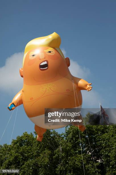 The Trump Baby, a six metre high inflatable blimp flying above the Houses of Parliament in Westminster prior to the Together Against Trump national...