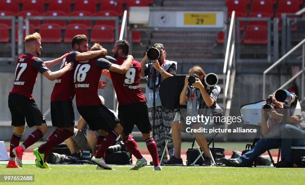 Nuremberg's Hanno Behrens celebrates his 1:0 goal with Sebastian Kerk , Enrico Valentini and Mikael Ishak during the German 2nd Bundesliga soccer...