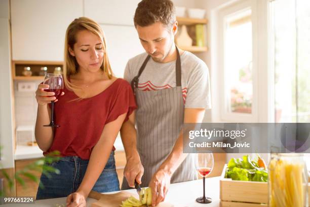 young couple in love in the kitchen - jovic stock pictures, royalty-free photos & images