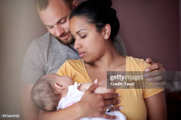 our little miracle - tired couple stock pictures, royalty-free photos & images