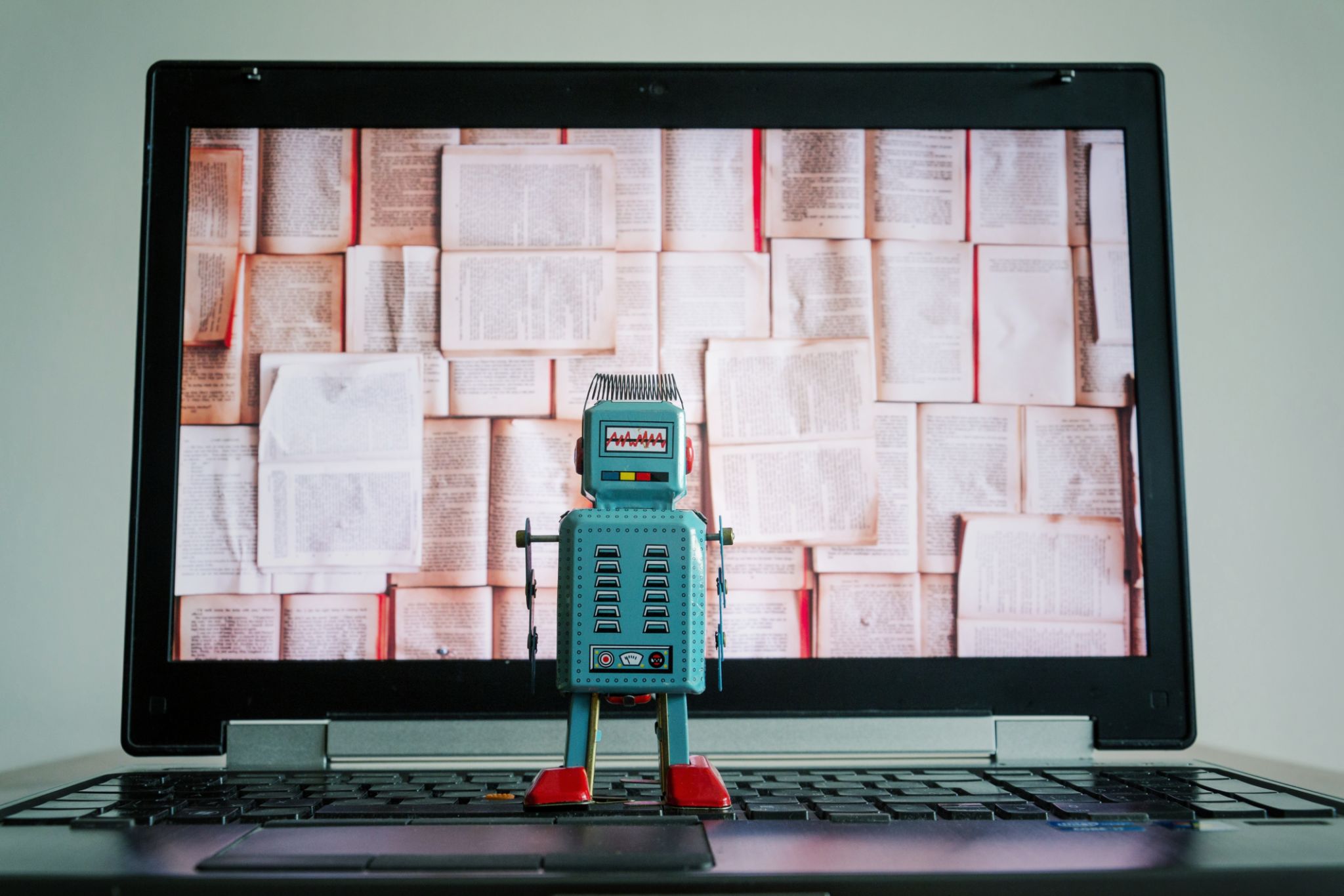 Robots with books screen, big data and deep learning concept Robots with books screen, big data and deep learning concept