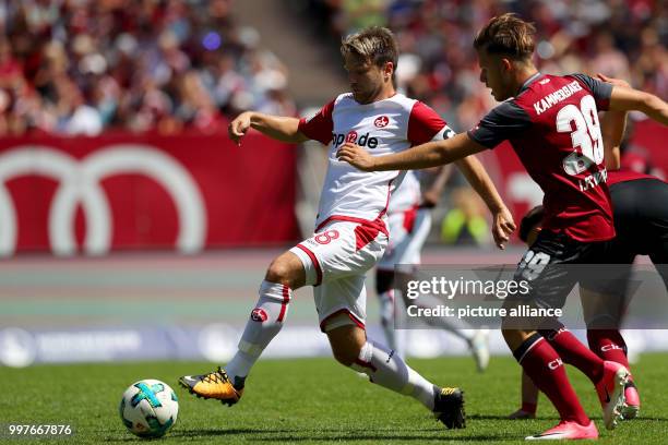 Nuremberg's Patrick Kammerbauer and Kaiserslautern's Patrick Salata in action during the German 2nd Bundesliga soccer match between 1. FC Nuremberg...