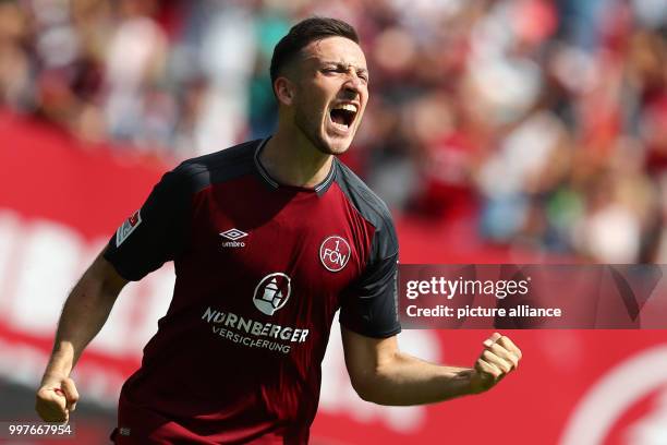 Nuremberg's Kevin Moehwald celebrates his 3:0 goal during the German 2nd Bundesliga soccer match between 1. FC Nuremberg and 1. FC Kaiserslautern at...