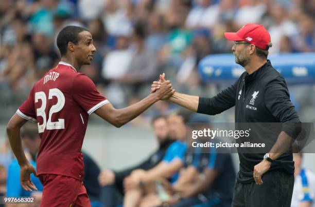 Liverpool's Joel Matip and coach Juergen Klopp shake hands during the international club friendly soccer match between Hertha BSC and FC Liverpool in...