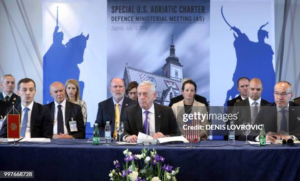 Secretary of Defence James Mattis looks on with Montenegro's Defence Minister Predrag Boskovic and Croatian Defence Minister Damir Krsticevic as he...