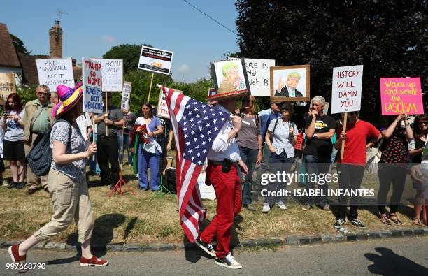 Man wears a Mexican hat and a US flag joins protesters against the UK visit of US President Donald Trump outside Chequers, the prime minister's...