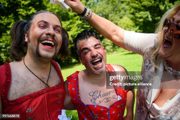 Participants 'David O. Riedel' and 'Comedy El Papa' wait for the start of the competition at the 'Dirndl-Flug-Weltmeisterschaft' in Nuremberg,...