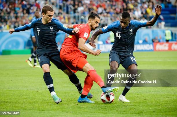 Nacer Chadli of Belgium and Antoine Griezmann and Blaise Matuidi of France battle for the ball during the 2018 FIFA World Cup Russia Semi Final match...