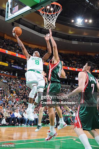 Rajon Rondo of the Boston Celtics lays the ball up in the lane against Dan Gadzuric of the Milwaukee Bucks on April 14, 2010 at the TD Garden in...