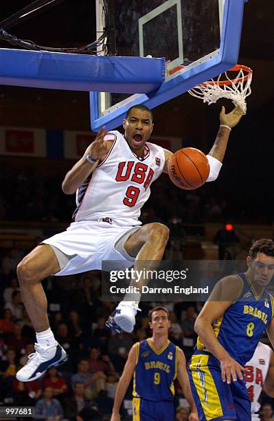 Kenyon Martin of the USA slam dunks during the Basketball semi-final between the United States and Brazil during the Goodwill Games in Brisbane,...