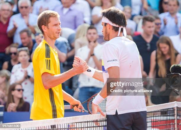 Leonardo Mayer of Argentina and Florian Mayer of Germany shake hands after the men's singles final of the Tennis ATP-Tour German Open in Hamburg,...