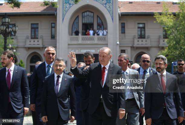 President of Turkey, Recep Tayyip Erdogan greets people as he walks to attend the Opening Ceremony of the 1st Presidential Cabinet Meeting at former...