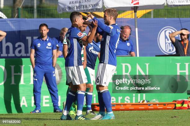 Schalke's Amine Harit celebrates with Schalke's Johannes Geis during the football friendly between FC Schalke 04 and SD Eibar in Mittersill, Austria,...