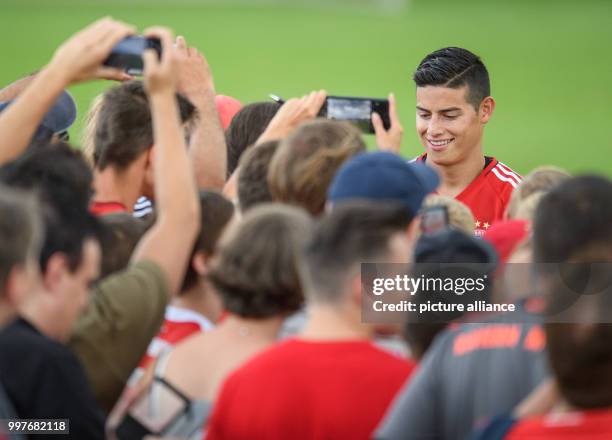 James Rodriguez of Bayern Munich signs autographs at the club's training ground on Saebener Strasse in Munich, Germany, 30 July 2017. Photo: Matthias...