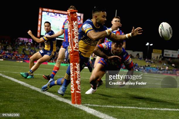 Bevan French of the Eels attempts to score a try which was disallowed during the round 18 NRL match between the Newcastle Knights and the Parramatta...