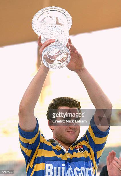 Chris Malone of University holds the Mastercard Cup after victory in the Citibank Mastercard Cup grand final between Sydney University and Eastwood...