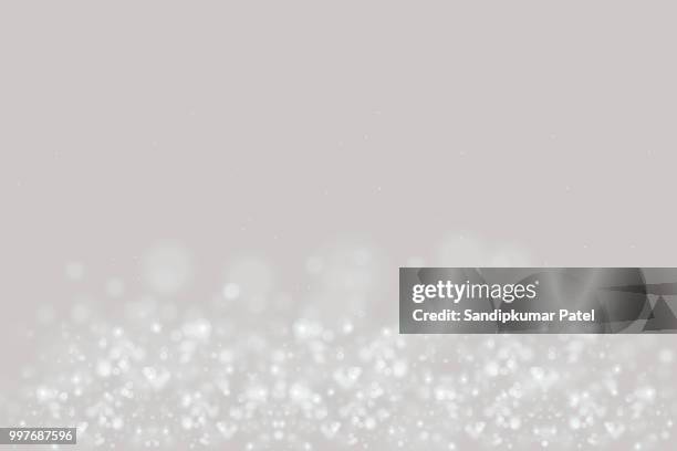 glühende partikel-hintergrund - silver-glitter-white-background stock-grafiken, -clipart, -cartoons und -symbole