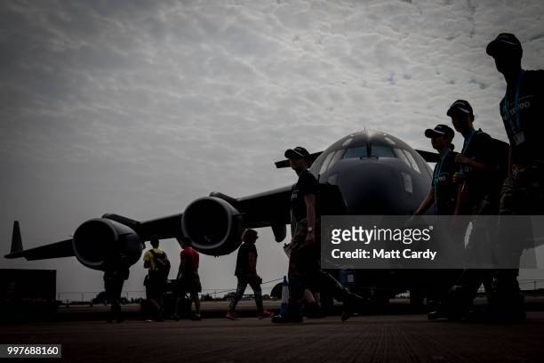 People stand in front of a Canadian Airforce C-17 Globemaster at the Royal International Air Tattoo at RAF Fairford on July 13, 2018 in Fairford,...