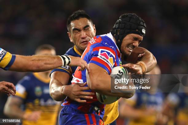 Sione Mata'utia of the Knights is tackled during the round 18 NRL match between the Newcastle Knights and the Parramatta Eels at McDonald Jones...