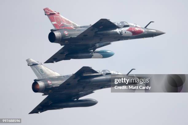 Two Couteau Delta Mirage 2000Ds perform at the Royal International Air Tattoo at RAF Fairford on July 13, 2018 in Fairford, Gloucestershire, England....