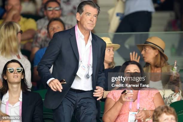 Dylan Brosnan, Pierce Brosnan and Keely Shaye Smith attend day eleven of the Wimbledon Tennis Championships at the All England Lawn Tennis and...