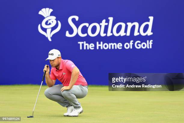 Tyrrell Hatton of England lines up his putt on hole eighteen during day two of the Aberdeen Standard Investments Scottish Open at Gullane Golf Course...