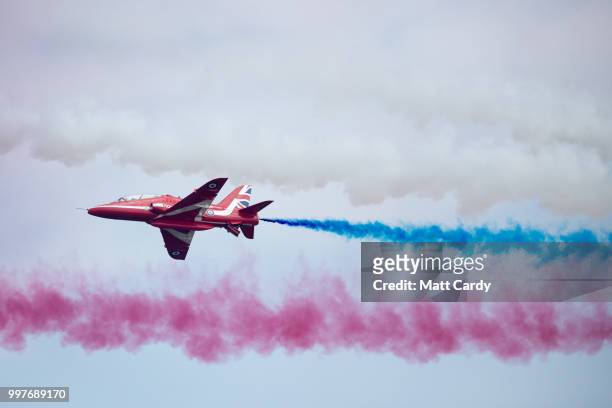 BAe Hawks from the Royal Airforce aerobatic team, the Red Arrows, perform at the Royal International Air Tattoo at RAF Fairford on July 13, 2018 in...
