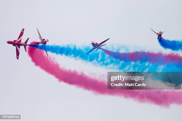 BAe Hawks from the Royal Airforce aerobatic team, the Red Arrows, perform at the Royal International Air Tattoo at RAF Fairford on July 13, 2018 in...