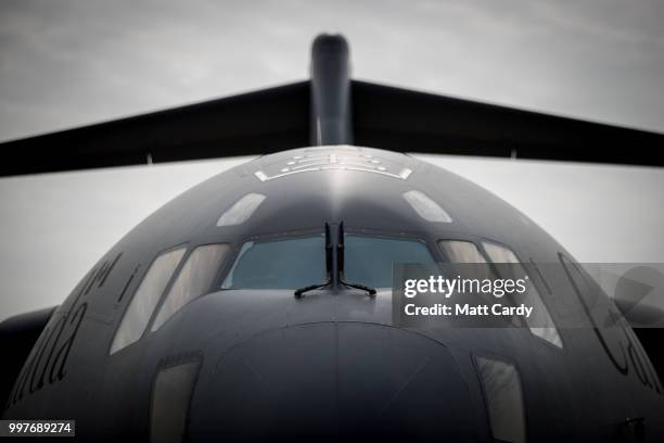 People stand in front of a Canadian Airforce C-17 Globemaster at the Royal International Air Tattoo at RAF Fairford on July 13, 2018 in Fairford,...