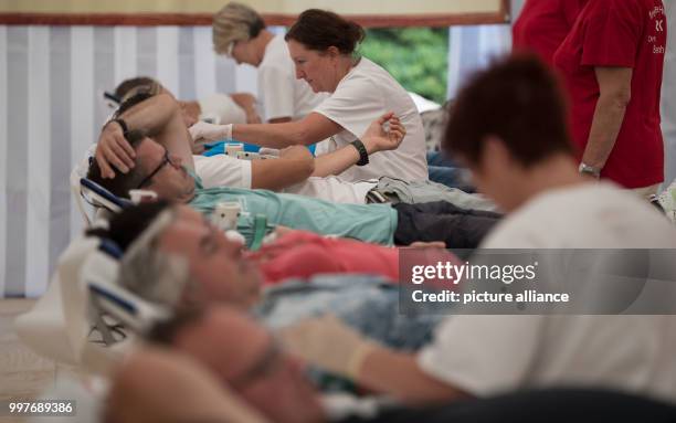 Nurses draw blood in front of the adventure park Tripsdrill in Cleebronn, Germany, 31 July 2017. In order to avoid supply gaps during the summer...