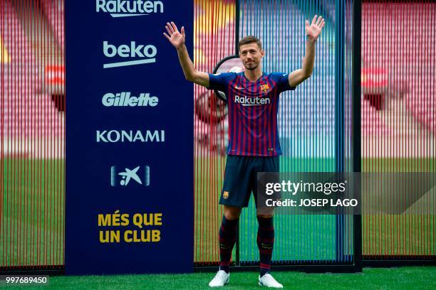 Barcelona's new player French defender Clement Lenglet poses during his official presentation at the Camp Nou stadium in Barcelona on July 13, 2018....