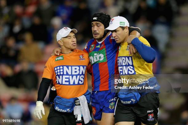 Sione Mata'Utia of the Knights is taken off for an injury yduring the round 18 NRL match between the Newcastle Knights and the Parramatta Eels at...