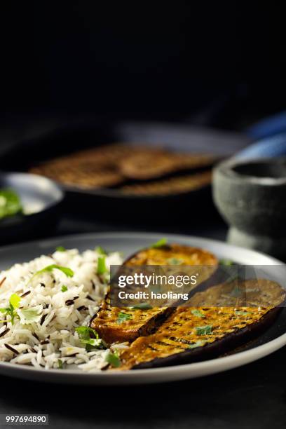 healthy grilled aubergine steak with rice - haoliang stock pictures, royalty-free photos & images