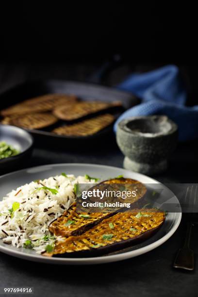healthy grilled aubergine steak with rice - haoliang stock pictures, royalty-free photos & images