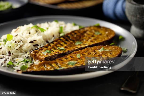 healthy grilled aubergine steak with rice - haoliang stock pictures, royalty-free photos & images