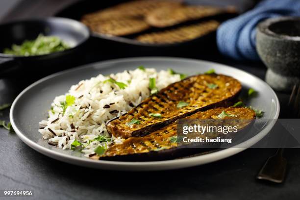 healthy grilled aubergine steak with rice - haoliang stock pictures, royalty-free photos & images