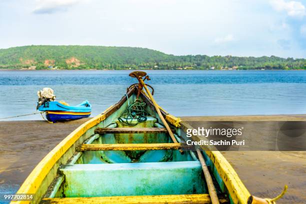 a boat waiting for weather to clear - sachin stockfoto's en -beelden
