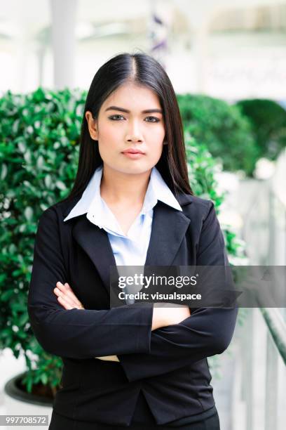 portrait of a young asian businesswoman. - vanguardians stock pictures, royalty-free photos & images